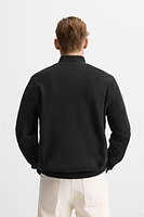 QUARTER ZIP SWEATER