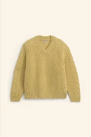 Relaxed fit sweater of spun wool fabric. V-neck and long sleeves. Rib trim.