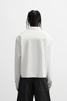 CROPPED FIT PIERCING SHIRT