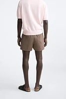 BUTTON SHORT SWIMMING TRUNKS