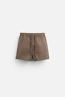 BUTTON SHORT SWIMMING TRUNKS