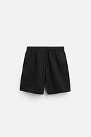 LONGLINE SWIMMING TRUNKS