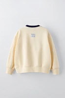 TEXT PRINT FLOCKED SWEATSHIRT