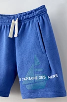 TEXT BOAT SHORTS