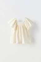 TEXTURED OVERSIZED RUFFLE BLOUSE