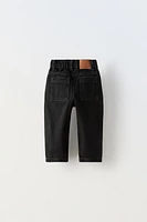 TAPERED BUTTON JEANS