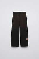 WASHED EFFECT LABEL PANTS