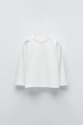 T-SHIRT UNI À ÉTIQUETTE