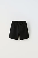 PIQUÉ STRETCH SHORTS