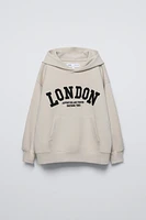 TEXT PRINT HOODED SWEATSHIRT