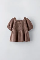 EMBROIDERED SMOCKED KNIT TOP