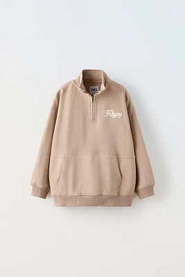 EMBROIDERED ZIP SWEATSHIRT