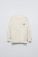 TEXT PRINT FLOCKED SWEATSHIRT