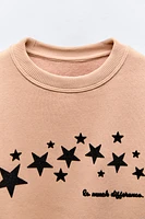 FLOCKED TEXT STAR SWEATSHIRT