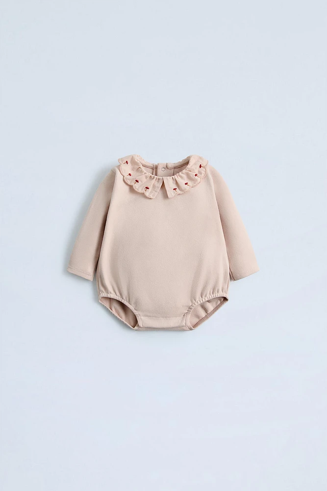 RUFFLED COLLAR BODYSUIT