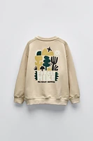 RAISED PRINT SWEATSHIRT