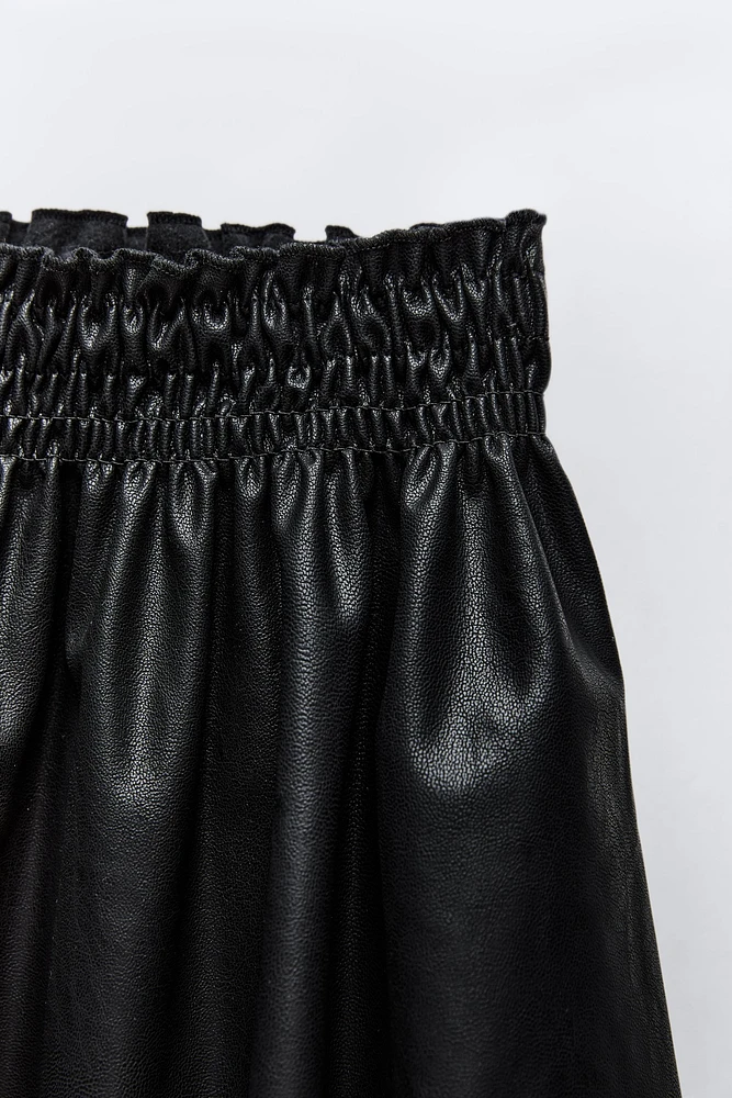 FAUX LEATHER SMOCKING SKIRT