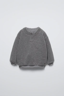 FAUX SHEARLING LINED SWEATSHIRT