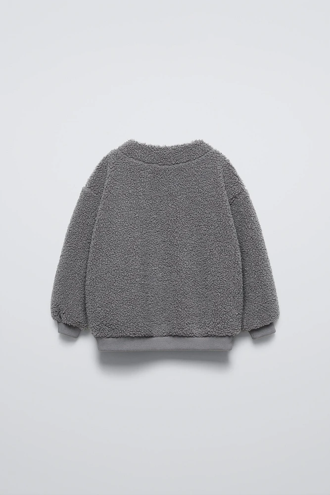 FAUX SHEARLING LINED SWEATSHIRT