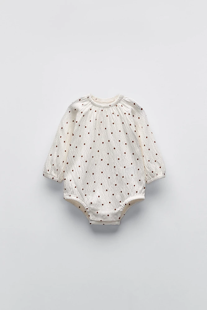 TEXTURED POLKA DOT BODYSUIT