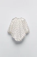 TEXTURED POLKA DOT BODYSUIT