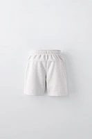 EMBROIDERED PLUSH SHORTS