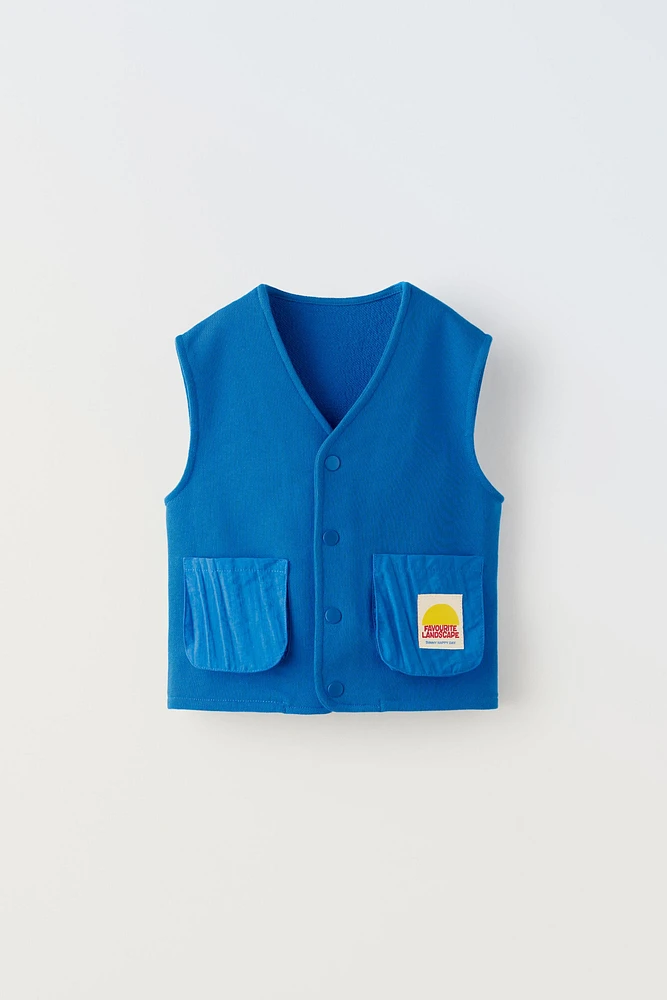 LABEL TRIM MIXED POCKET VEST