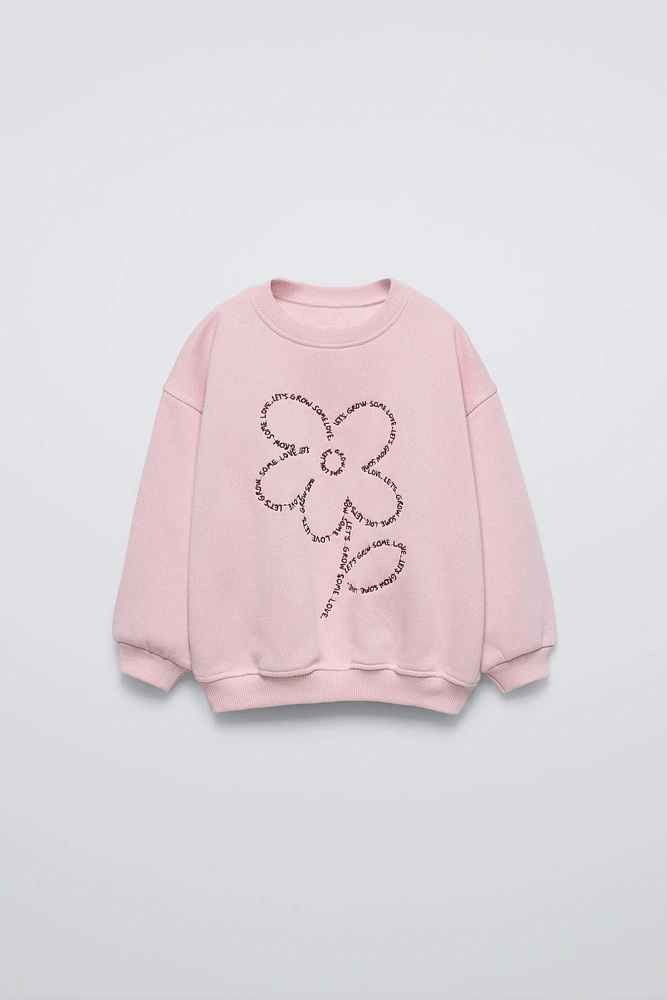 EMBROIDERED TEXT FLOWER SWEATSHIRT