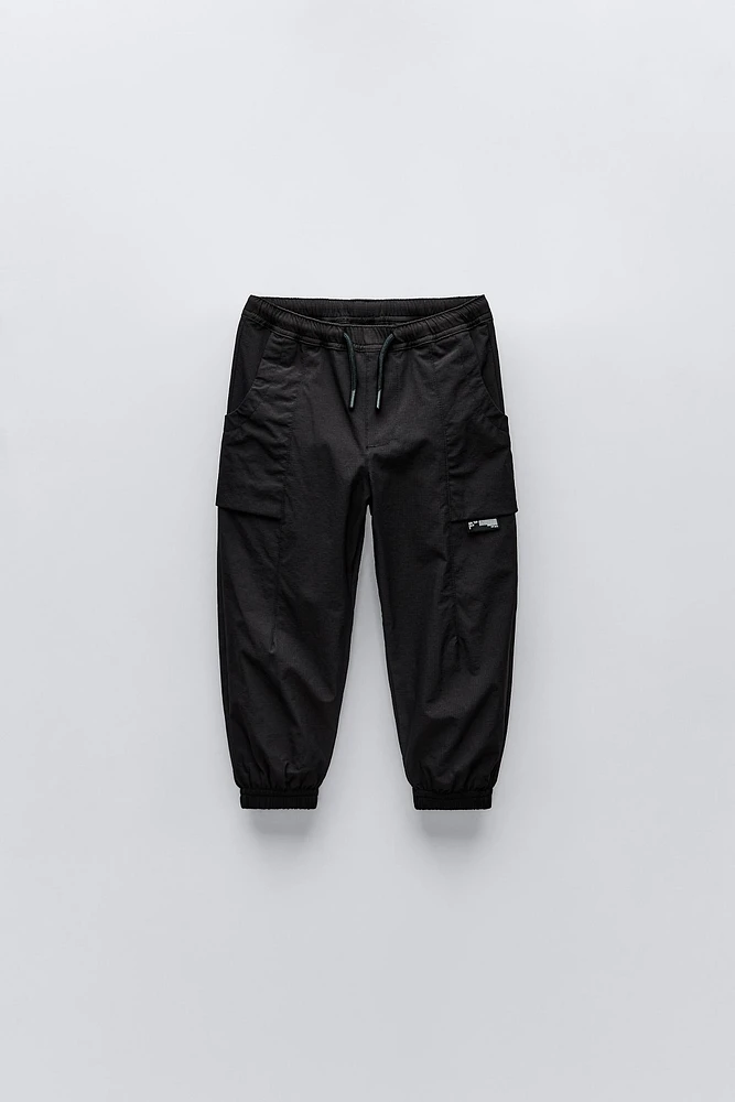 TECHNICAL FABRIC LINED PANTS WITH LABEL