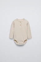 SOFT TOUCH RIBBED BODYSUIT