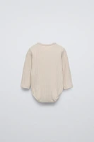 SOFT TOUCH RIBBED BODYSUIT