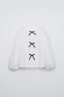 SHIRT WITH BOW APPLIQUE