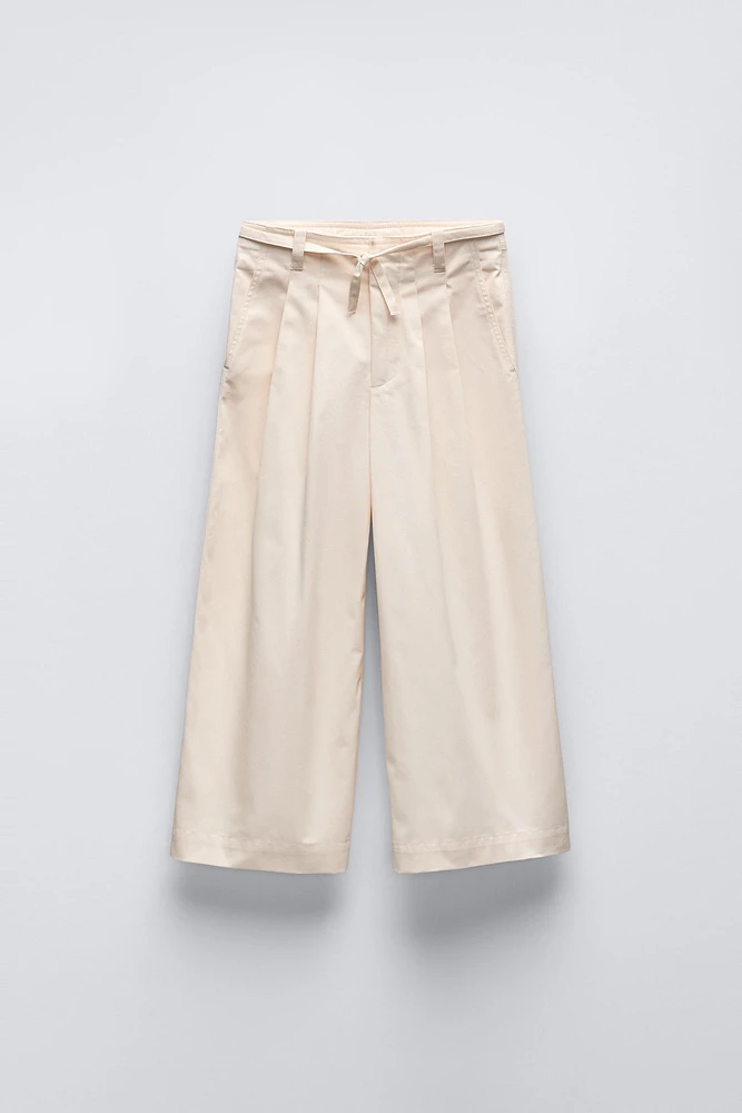 BELTED PLEATED PANTS