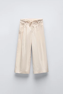 BELTED PLEATED PANTS