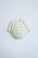 MUSLIN BIRD WRAP BODYSUIT