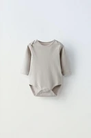 FIVE PACK OF BUNNY BODYSUITS