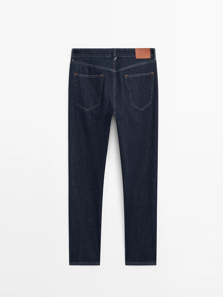 Cotton blend tapered fit selvedge jeans