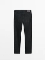 Tapered-fit denim-effect trousers