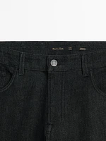 Tapered-fit denim-effect trousers