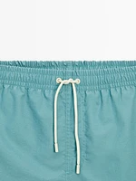 Plain pigment swimming trunks