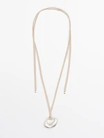 Adjustable cord necklace with abstract piece