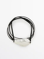 Leather cord bracelet with asymmetric piece