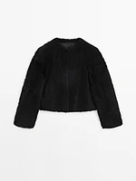 Reversible voluminous hair on leather coat