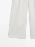 Wide-leg flowing trousers with darts