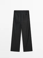 Darted pinstripe trousers