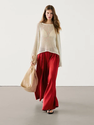 Flared trousers with pleated detail