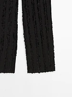 Trousers with fringe detail