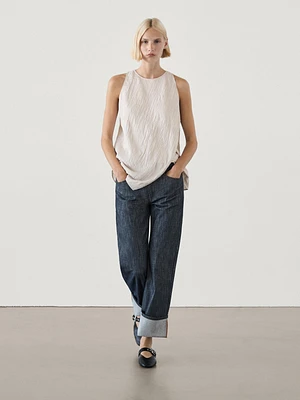 Textured top with asymmetric hem