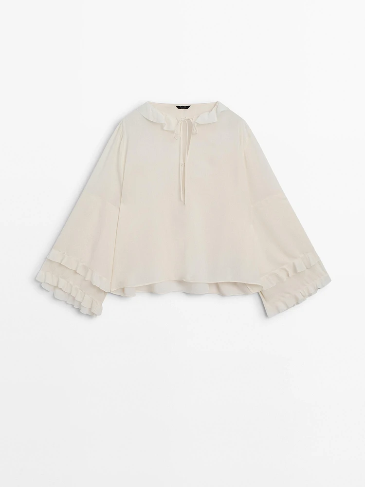 Shirt with ruffled sleeves