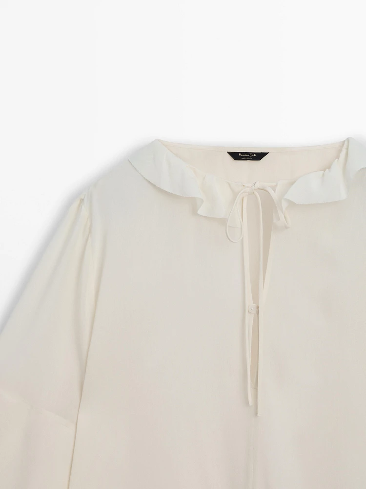 Shirt with ruffled sleeves